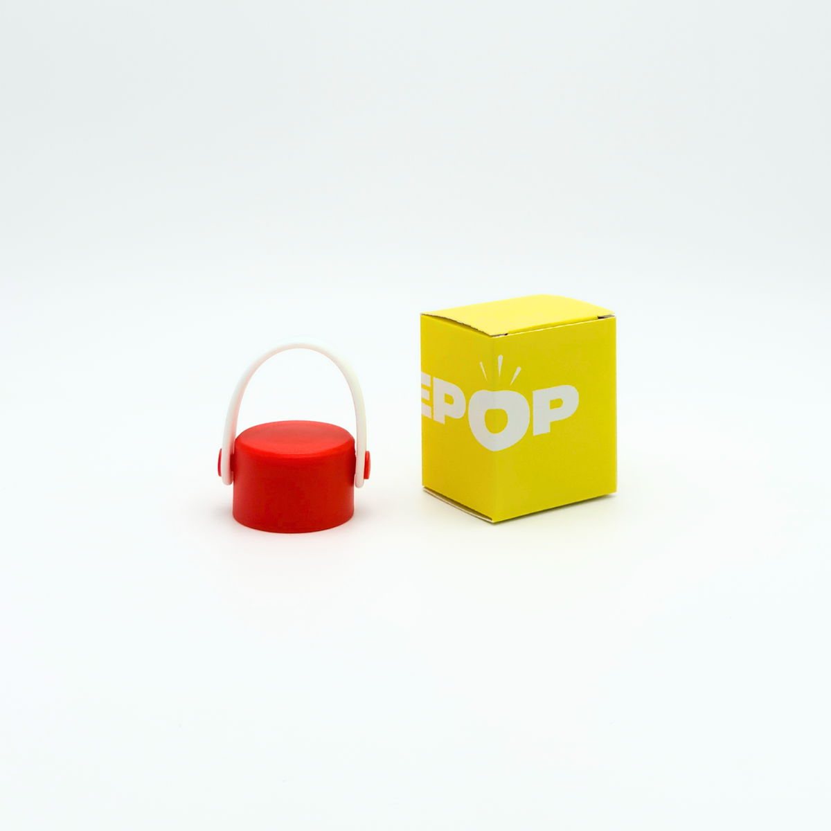 A Core Series Carry Lid in red and white sits next to a yellow box labeled PUREPOP on a white background.