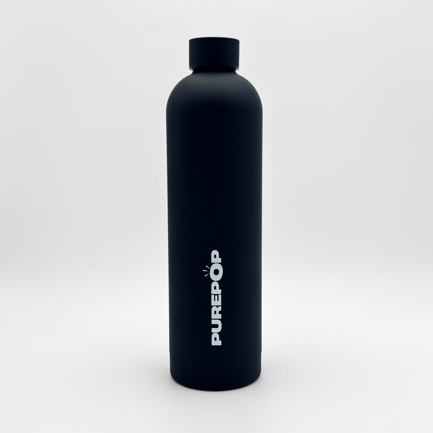 A Core Series Plus | Onyx Black water bottle stands upright on a white background. Crafted from double-walled stainless steel, this insulated flask features a sleek black cap and the word PUREPOP printed vertically in white letters on its side.