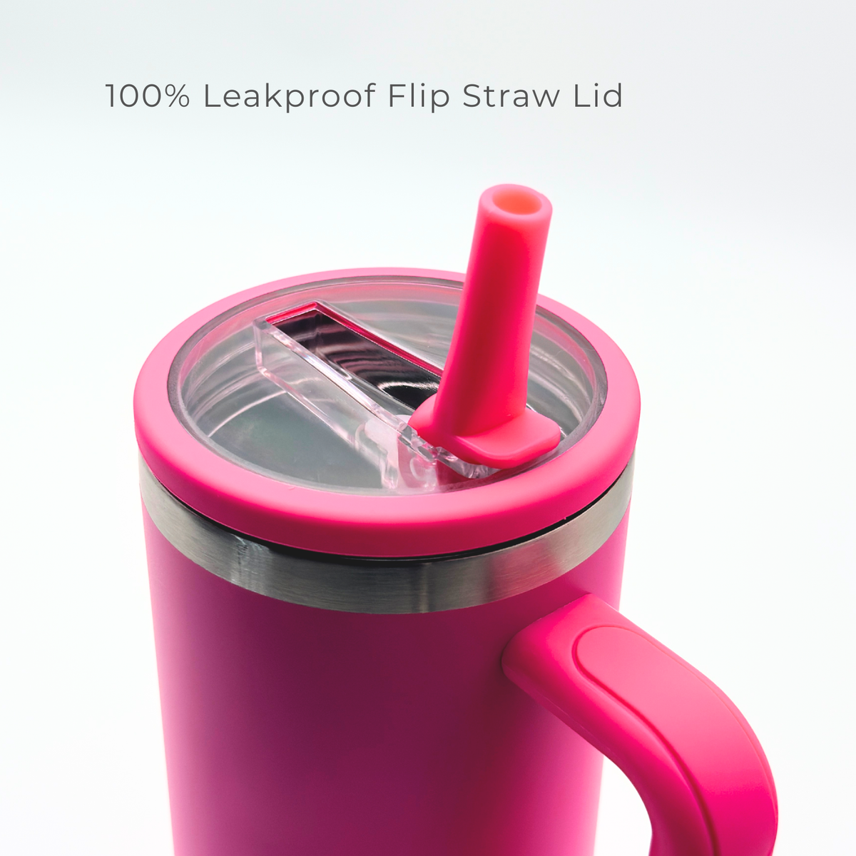A close-up of PurePop™ Carry Series | Hot Pink tumbler with a clear flip straw lid and silicone straw. Text above reads “100% Leakproof Flip Straw Lid.” The sturdy handle stands out against a white background.