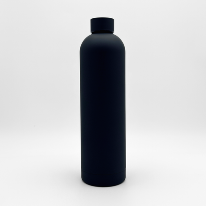 The Core Series Plus | Onyx Black bottle, a black cylindrical insulated flask with a matching cap, is centered against a plain white background. Featuring a smooth matte finish free of visible labels or markings, this bottle’s double-walled stainless steel construction ensures optimal temperature retention. Its sleek silhouette suggests a leakproof lid designed for both convenience and reliability.