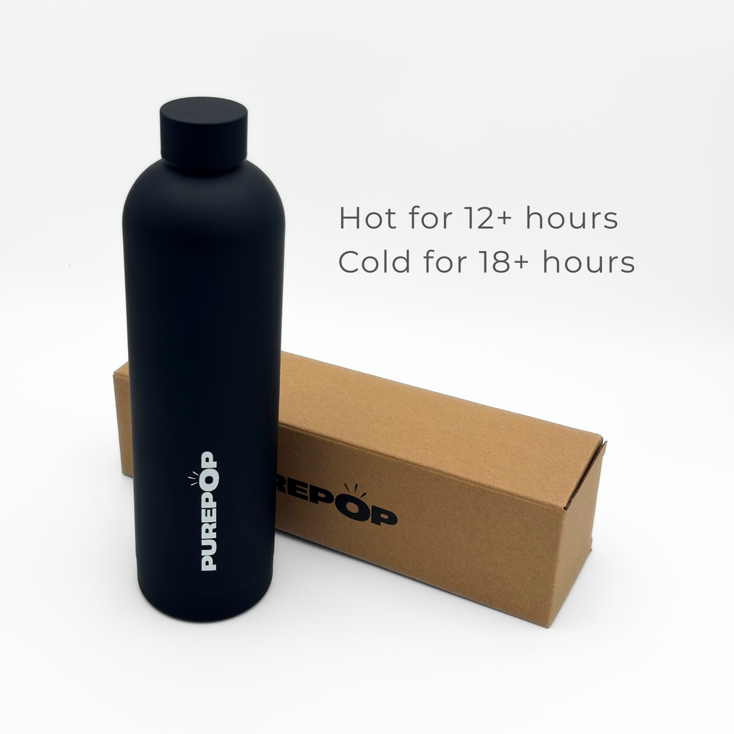 A Core Series Plus | Onyx Black double-walled stainless steel bottle stands next to a brown box. Text reads, “Hot for 12+ hours, Cold for 18+ hours.” The scene has a white background.