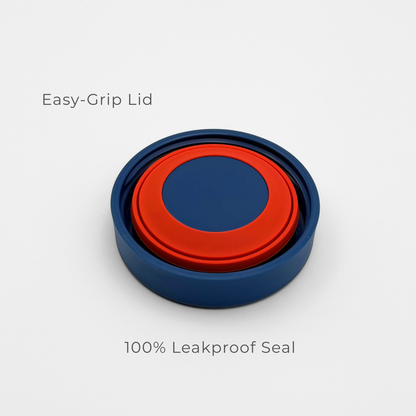 The Purepop Food Flask | Royal Blue is shown on a white background with a blue and red circular lid, featuring “Easy-Grip Lid” above and “100% Leakproof Seal” below for effortless, secure use.