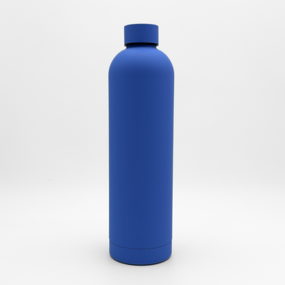 The Core Series Plus | Ultra Marine, a matte blue stainless steel thermal bottle with a matching cap, stands upright against a white background.