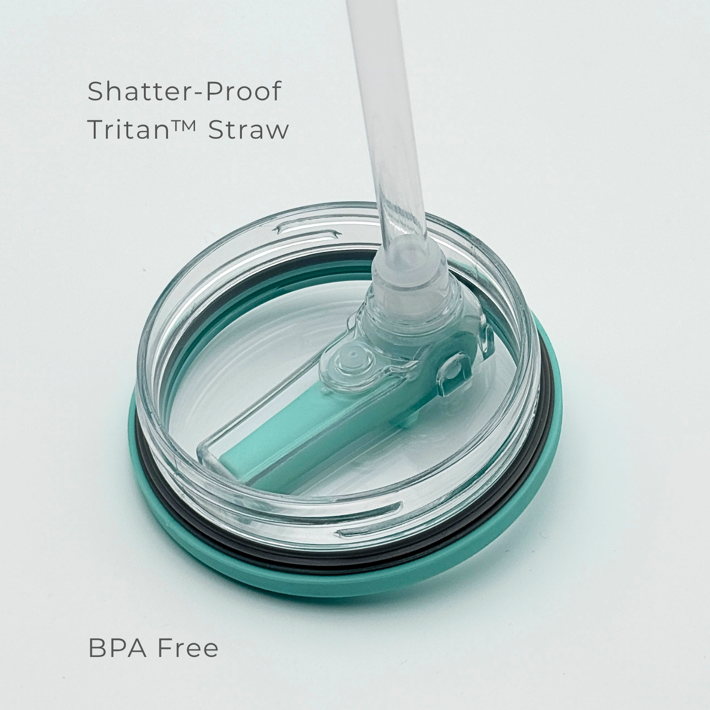 A close-up of PurePop™ Carry Series | Eucalyptus shows a BPA-free, shatter-proof Tritan™ straw on a teal and clear travel cup lid, highlighting its durable, safe material.
