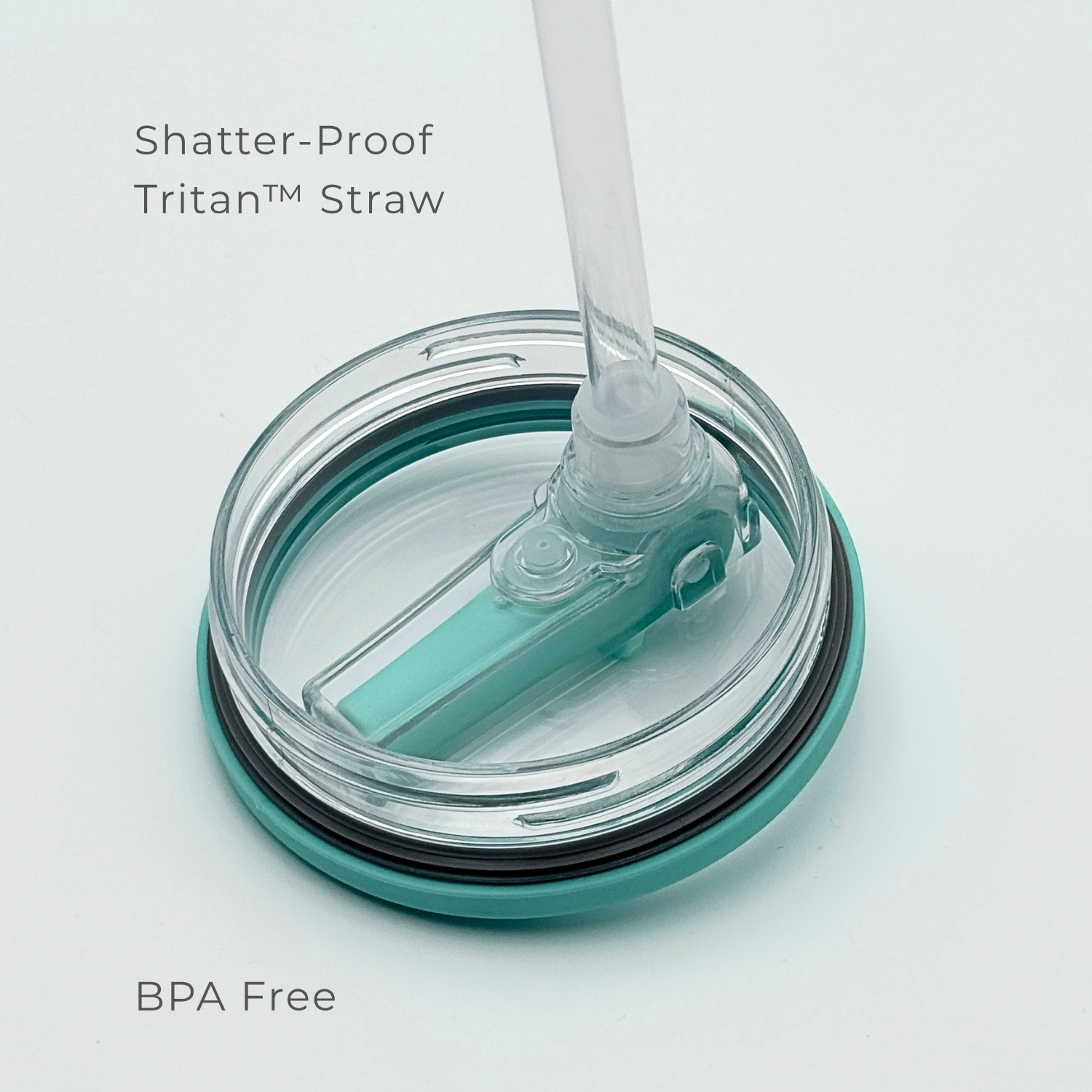A close-up of PurePop™ Carry Series | Eucalyptus shows a BPA-free, shatter-proof Tritan™ straw on a teal and clear travel cup lid, highlighting its durable, safe material.