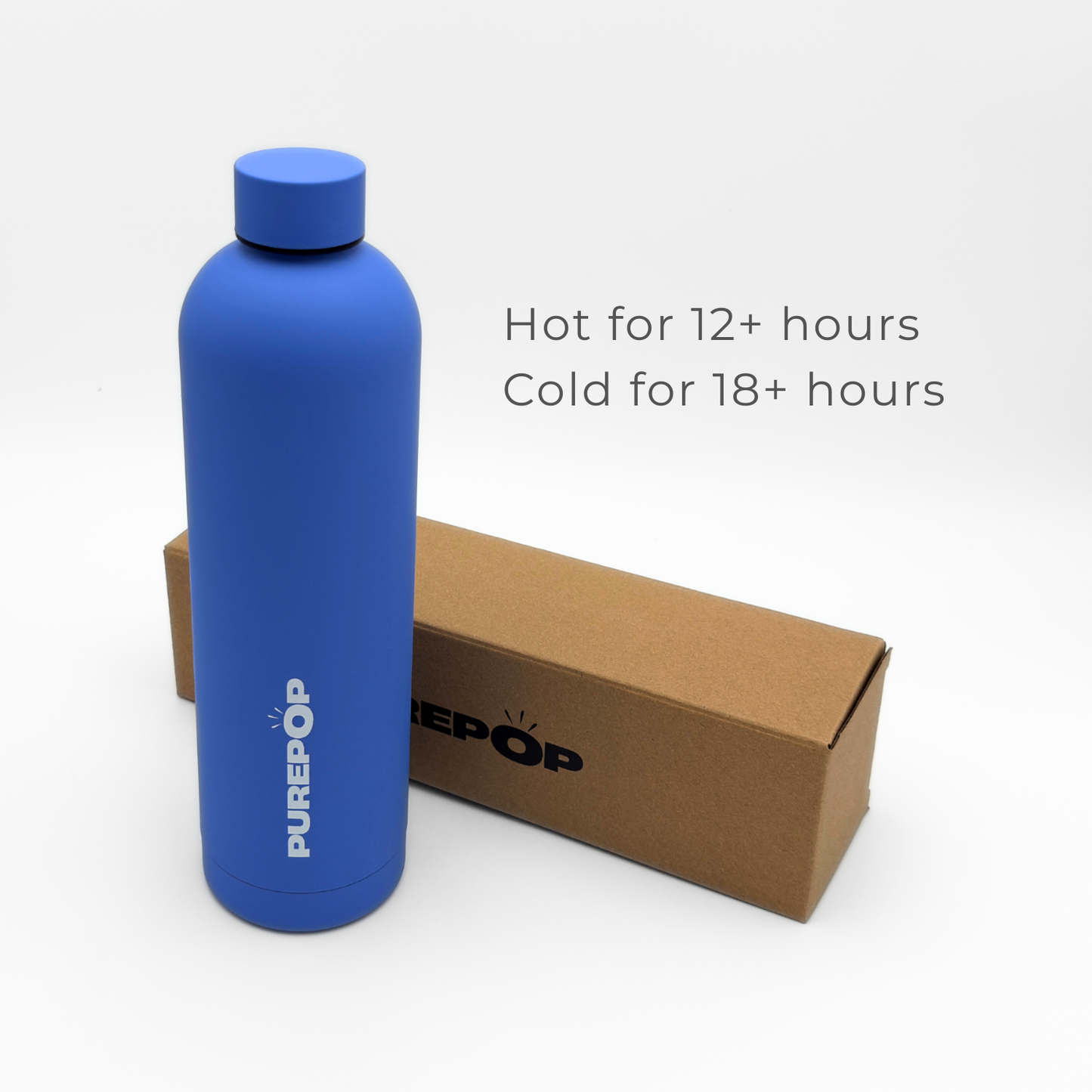 An Ultra Marine Core Series Plus PUREPOP stainless steel thermal bottle stands next to a brown box. Text beside the bottle reads: Hot for 12+ hours. Cold for 18+ hours.