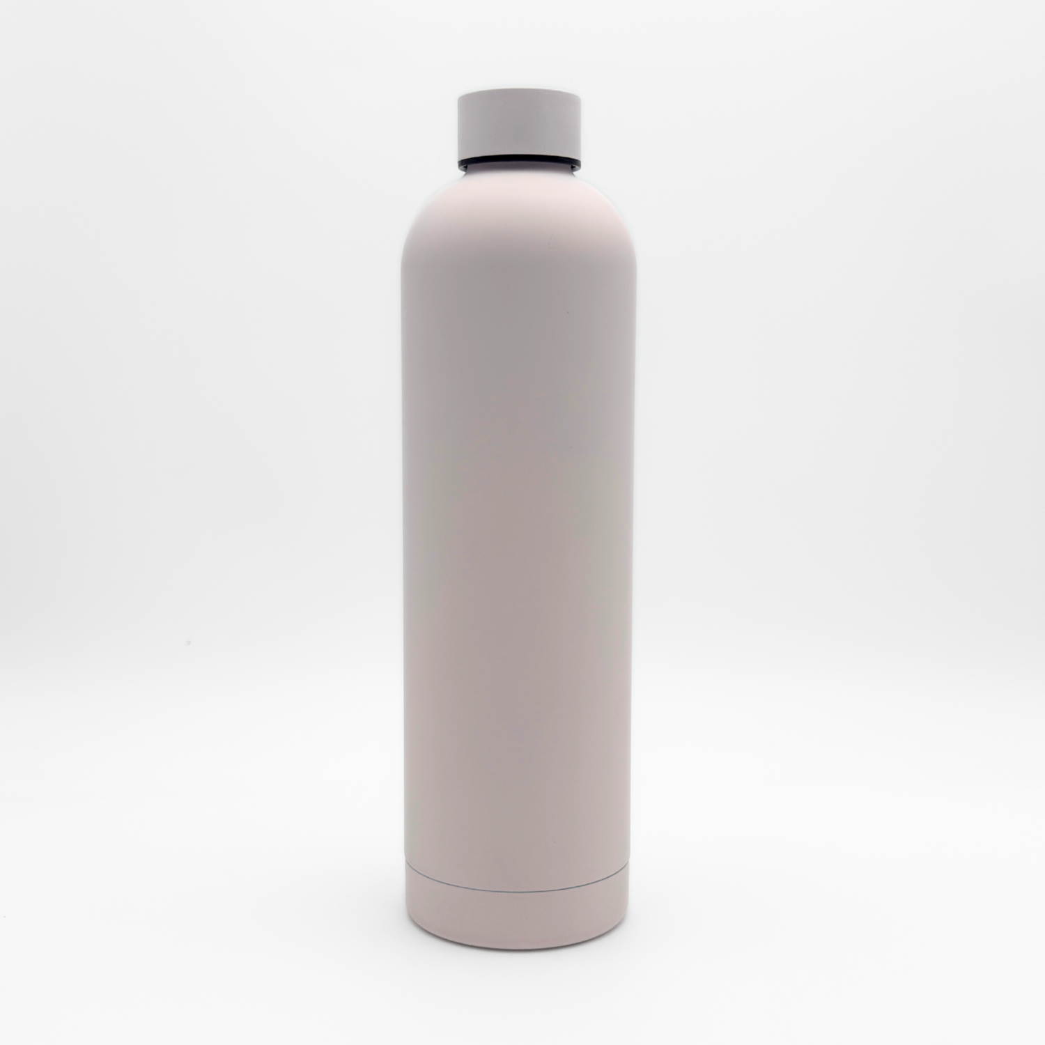 Core Series Plus | Cloud Pink reusable insulated flask, featuring a minimalist light pink design and a screw-on lid, standing upright against a plain white background.