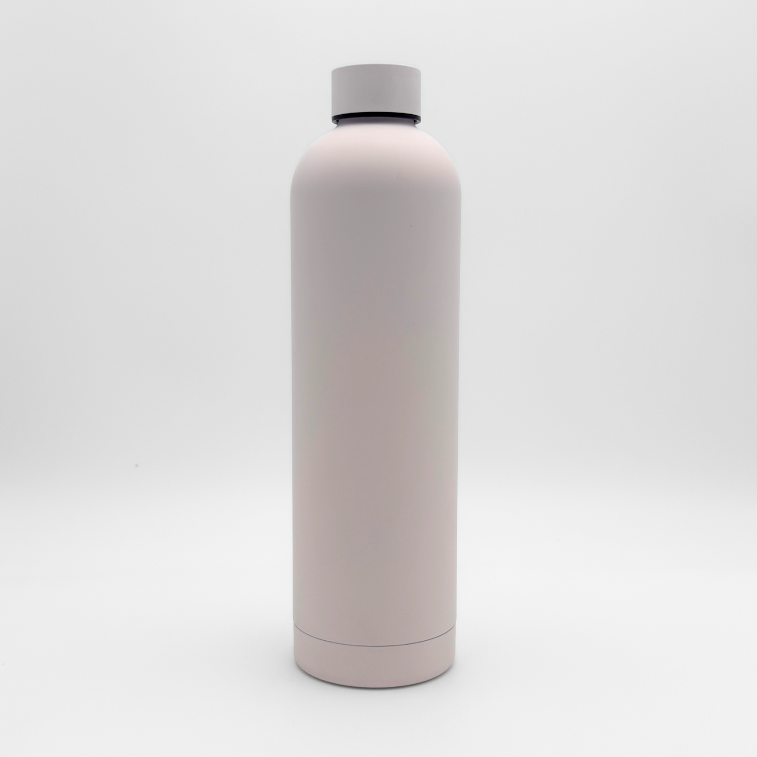 Standing upright on a plain white background is the Core Series Plus | Cloud Pink—a tall, cylindrical, light pink insulated flask with a matching screw-on lid. This double-walled stainless steel water bottle is designed to be completely leakproof for everyday use.