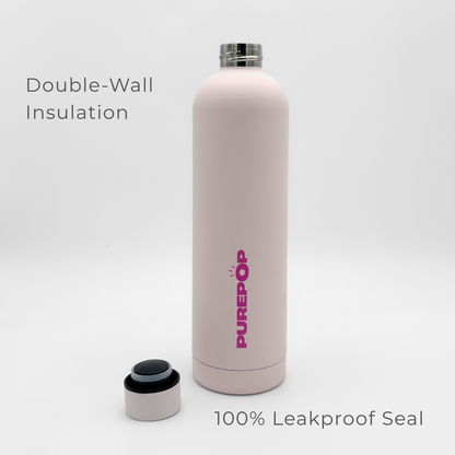 A light pink Core Series Plus | Cloud Pink insulated flask water bottle with the cap removed, revealing the interior. Text reads “Double-Wall Insulation” and “100% Leakproof Seal.” The double-walled stainless steel construction keeps your drinks at the ideal temperature. The background is plain white.
