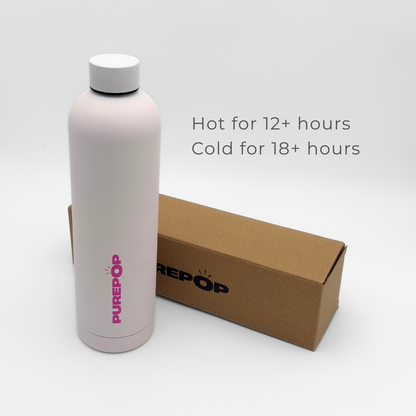 A white Core Series Plus | Cloud Pink double-walled stainless steel bottle with a cardboard box beside it. Text says: Hot for 12+ hours, Cold for 18+ hours. This insulated flask features a screw lid and the Core Series Plus logo printed in pink.