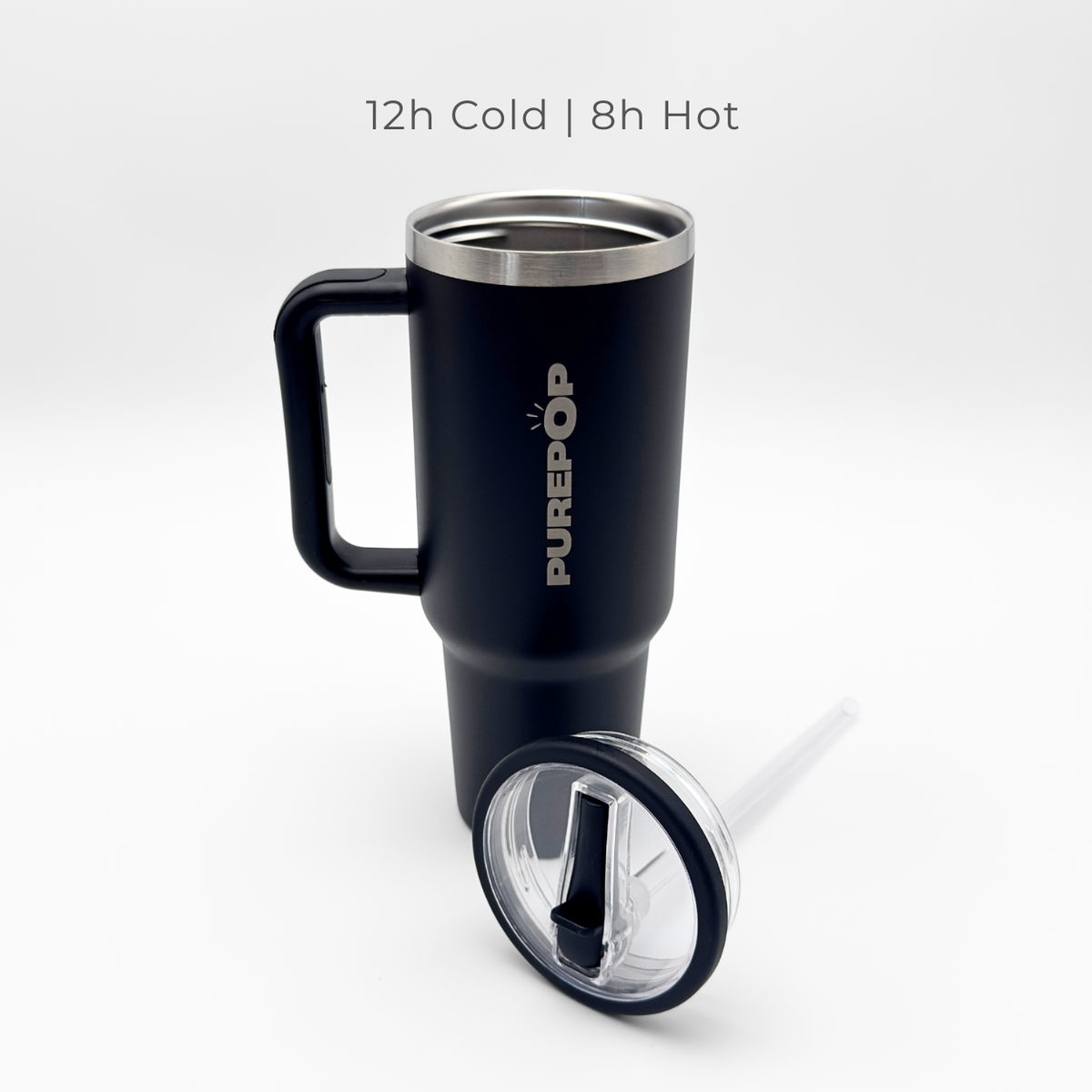 A Carry Series | Onyx Black travel mug by PurePop™ stands upright with its clear straw lid in front. Above, text reads: 12h Cold | 8h Hot. The background is white.