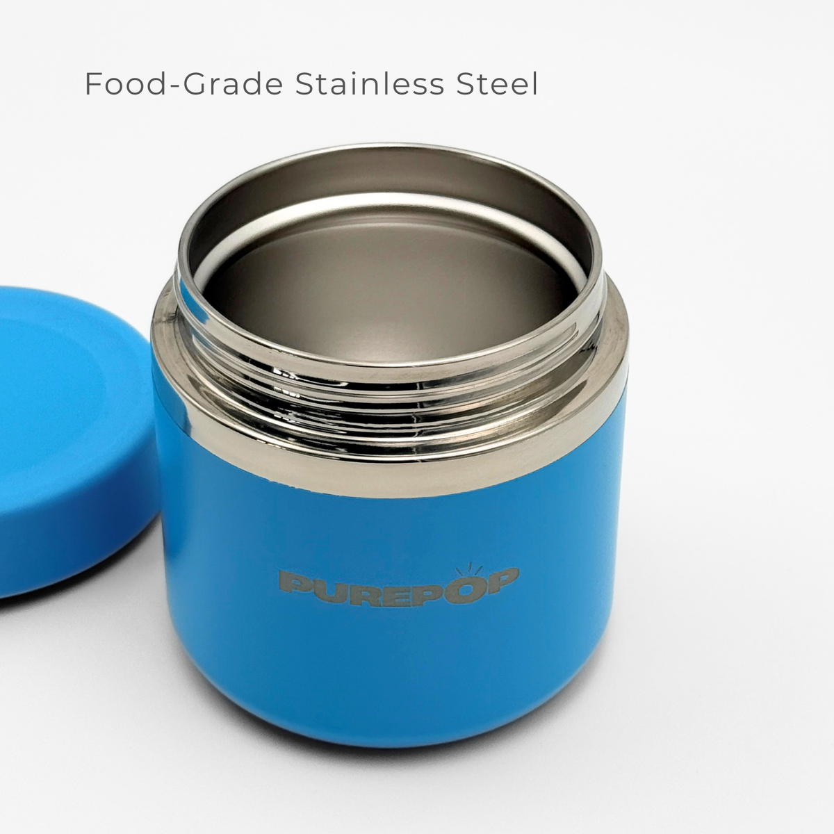 The Purepop Food Flask | Pacific Blue features an open insulated stainless steel container with a matching lid beside it, showcasing its shiny interior. “Food-Grade Stainless Steel” is displayed above.