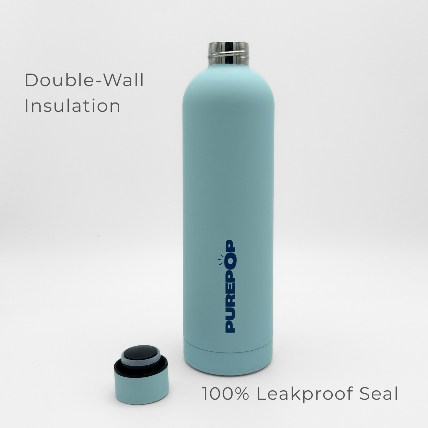 A Core Series Plus | Ice Blue insulated flask with a detached lid sits on a white background. Text reads: “Double-Wall Insulation” and “100% Leakproof Seal.”.