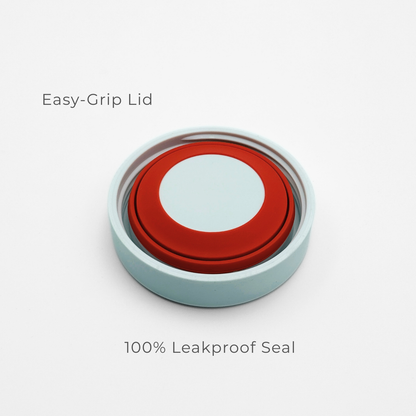A round, Frost White Purepop Food Flask Easy-Grip Lid is shown on a white background, with text emphasizing its 100% leakproof seal for convenience and reliability.