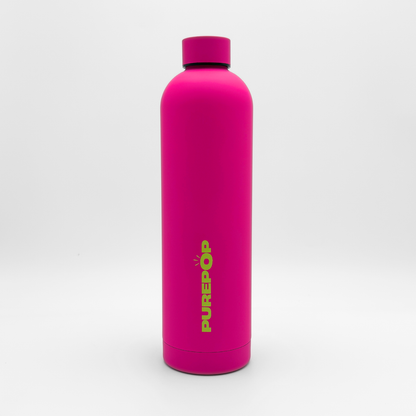 A blush magenta, reusable leakproof water bottle from the Core Series Plus stands upright on a white background. The bottle has a matching magenta cap and features the yellow text PUREPÖP printed vertically on its front.