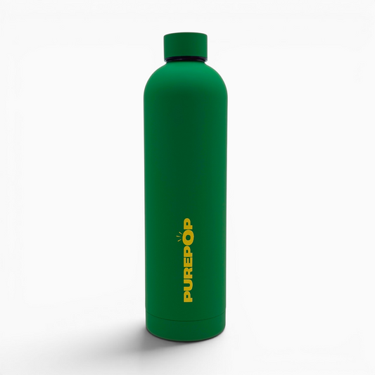 A green stainless steel thermal bottle from the Core Series Plus | Green & Gold stands upright on a white background. The word PUREPOP is printed vertically in bold yellow letters on the front of this leakproof water bottle, which features a matching cap.