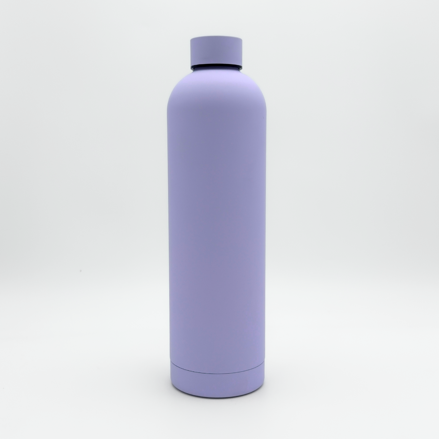 The Core Series Plus | Pastel Lilac, a matte lavender leakproof water bottle with a matching screw-on cap, is standing upright on a white background.