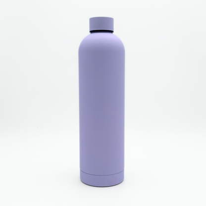 A Core Series Plus | Pastel Lilac insulated flask, featuring a tall cylindrical design and a screw-on lid, stands upright on a white background.