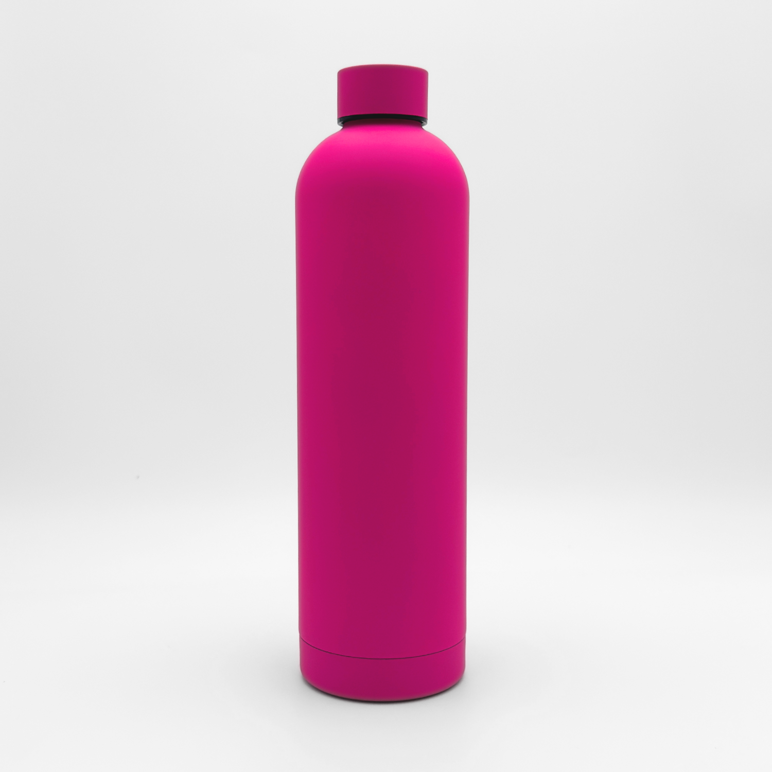The Core Series Plus | Blush Magenta, a bright pink cylindrical leakproof water bottle with a matching screw-on cap, stands upright on a plain white background.