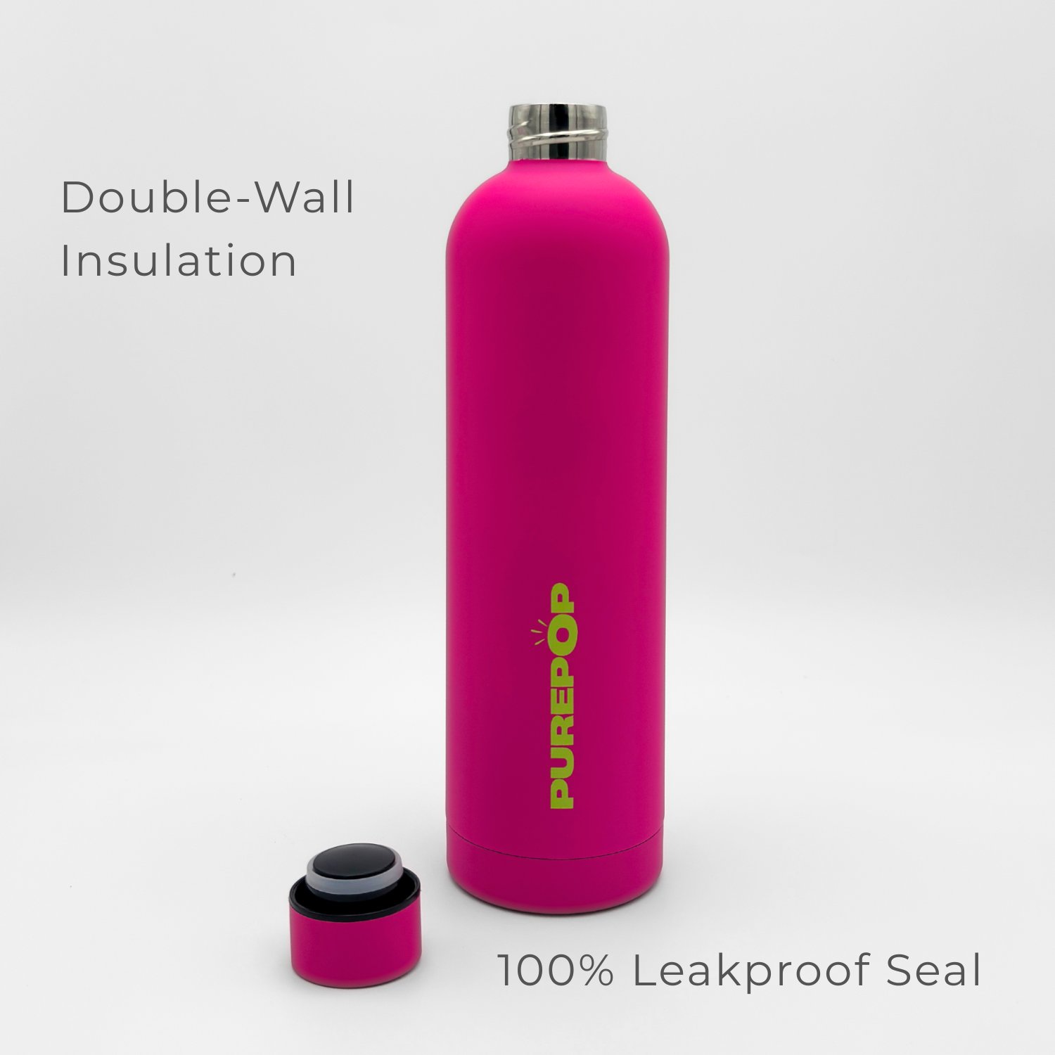 A bright magenta Core Series Plus | Blush Magenta water bottle with its lid off, revealing a black and white leakproof seal. Text reads: Double-Wall Insulation and 100% Leakproof Seal. This thermal stainless steel insulated flask keeps your drinks at the perfect temperature, sip after stylish sip.