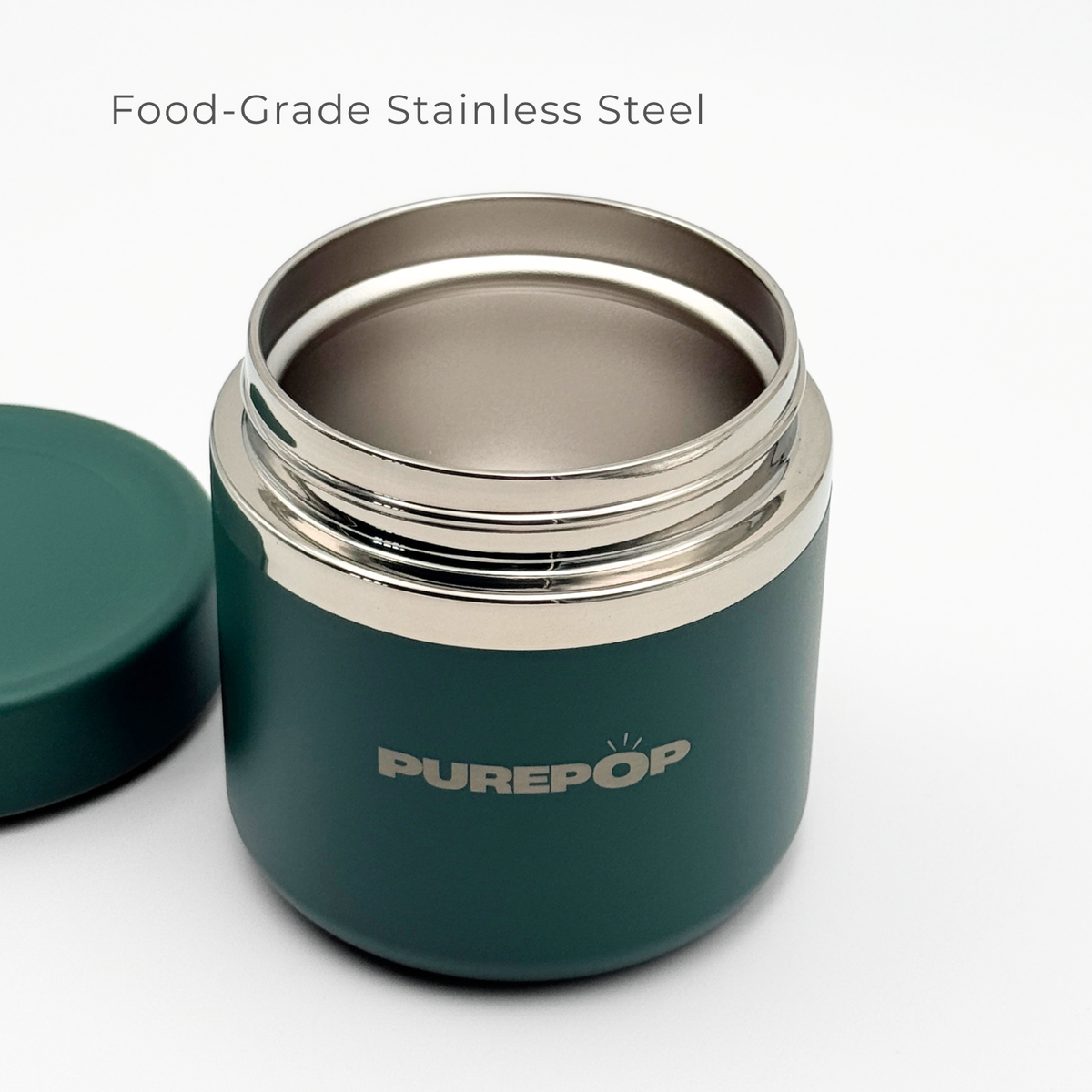 A Midnight Green and silver Purepop Food Flask with its lid off reveals a shiny, food-grade stainless steel interior. The text above reads “Food-Grade Stainless Steel.”.