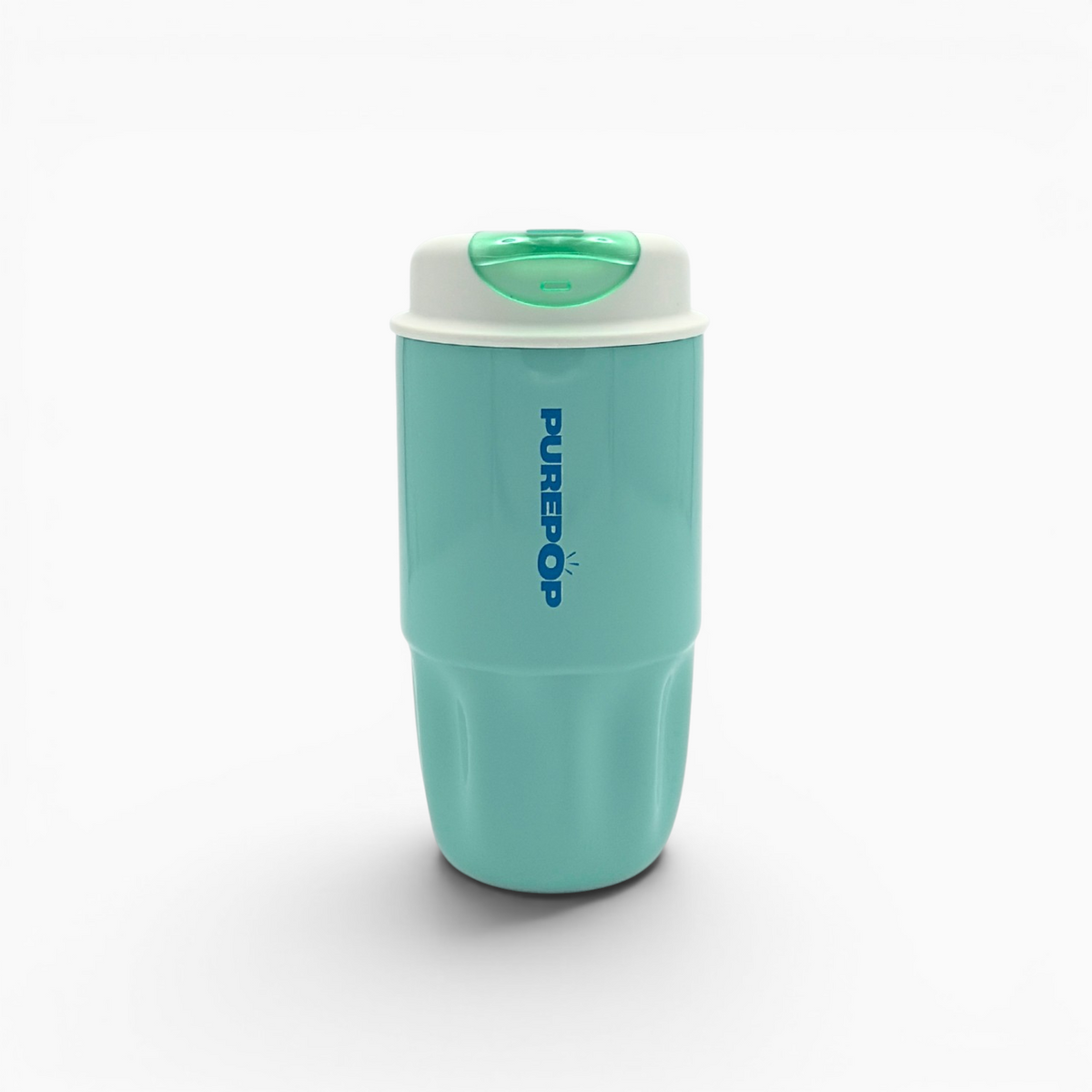 A Soft Aqua Sip Series travel mug stands upright on a white background, featuring a turquoise body, a white lid with a green button, and bold blue PUREPOP branding. This leakproof mug is perfect for enjoying your favorite beverages on the go.
