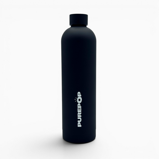 A matte black insulated flask from the Core Series Plus in Onyx Black stands upright with a screw cap. The word PUREPOP is printed vertically in bold white letters on the front against a plain white background.