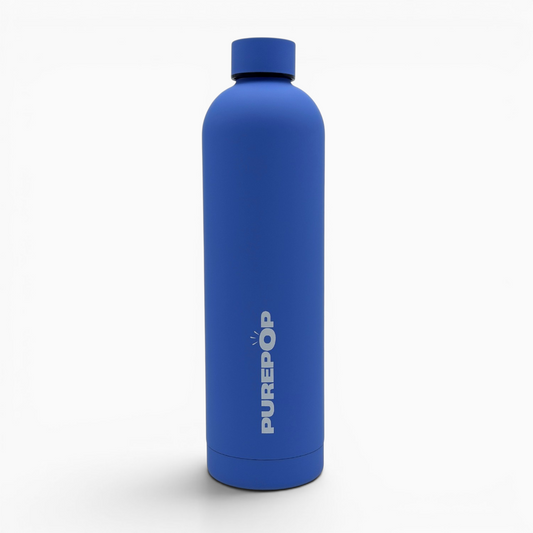 Introducing the Core Series Plus | Ultra Marine: a matte blue stainless steel reusable water bottle with PUREPOP printed vertically in white on the side. Designed with minimalist style, this insulated flask features a screw-on lid for reliable leakproof performance and lasting durability.