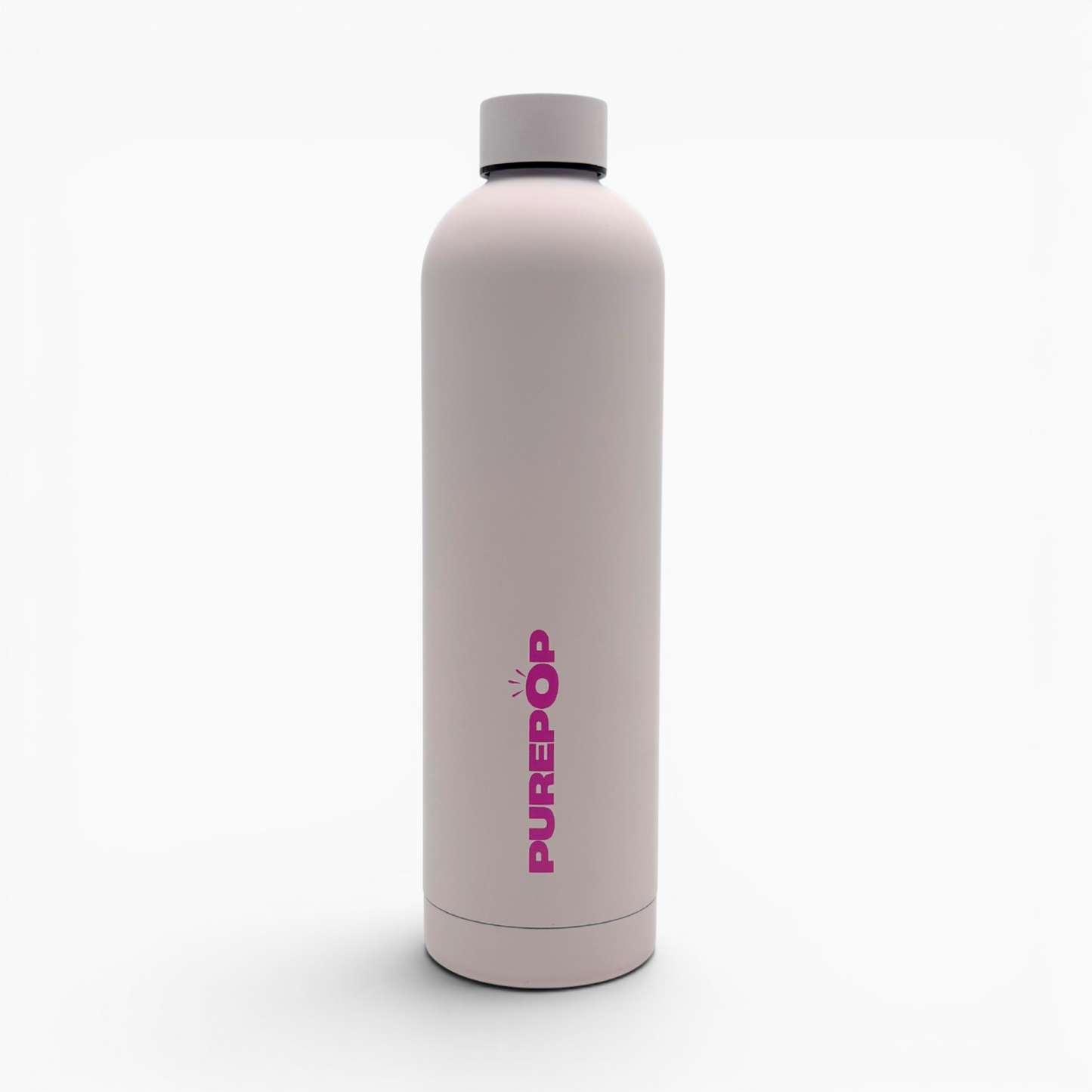 Introducing the Core Series Plus | Cloud Pink: a reusable, leakproof water bottle in light pink with a gray cap, standing upright. "PUREPOP" is printed vertically in bold pink letters on the front. Crafted with stainless steel thermal insulation, this insulated flask keeps your beverages at the ideal temperature. The product is set against a plain white background.