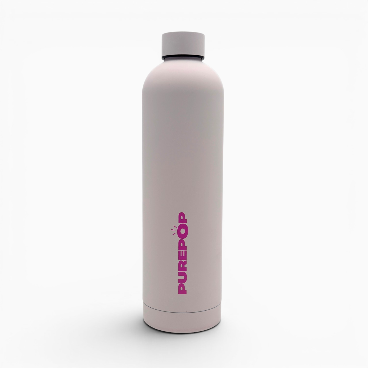 Introducing the Core Series Plus | Cloud Pink: a reusable, leakproof water bottle in light pink with a gray cap, standing upright. "PUREPOP" is printed vertically in bold pink letters on the front. Crafted with stainless steel thermal insulation, this insulated flask keeps your beverages at the ideal temperature. The product is set against a plain white background.