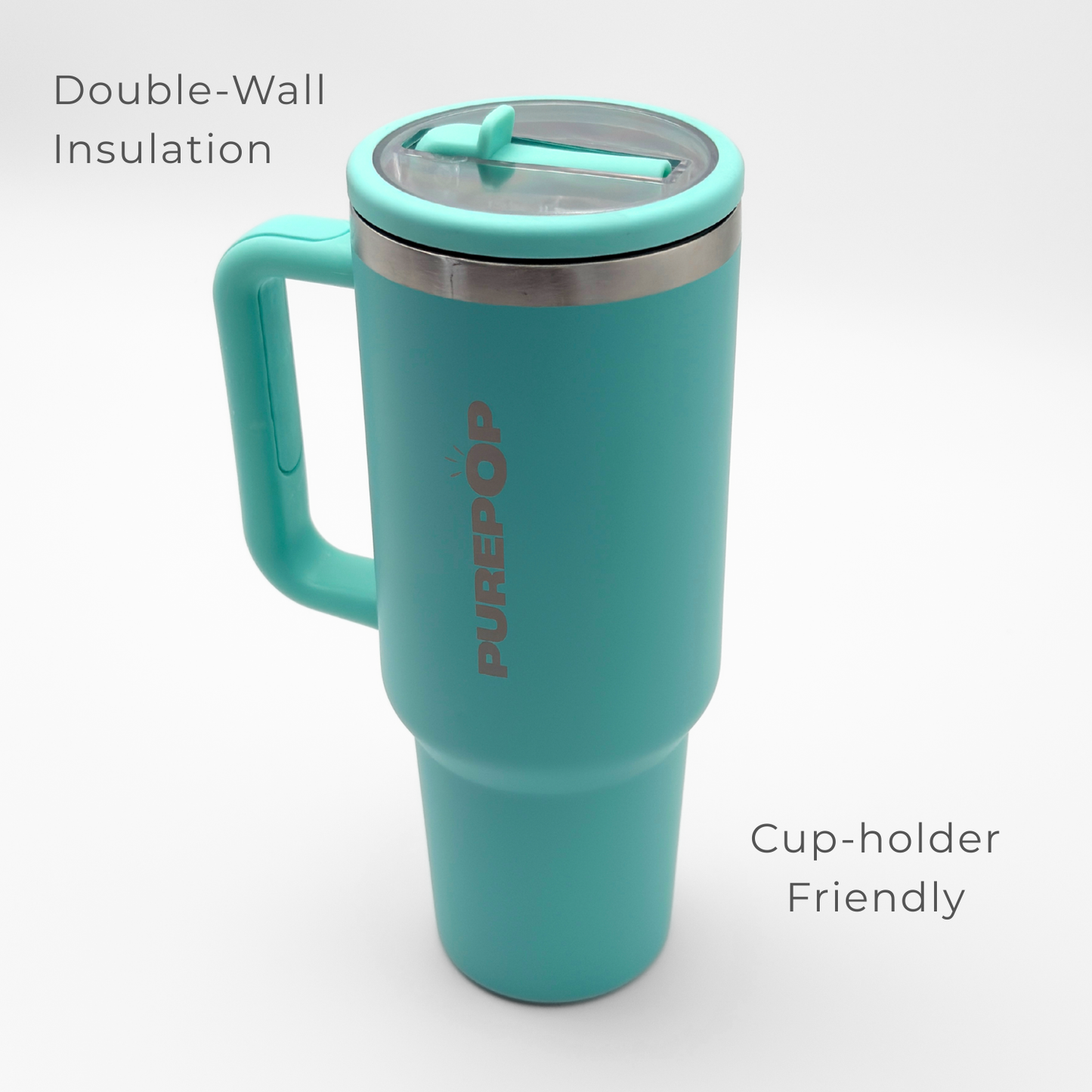 The PurePop™ Carry Series tumbler in Eucalyptus features a handle, lid, double-wall insulation, and a cup-holder friendly design. Its sleek look stands out against a plain white background.