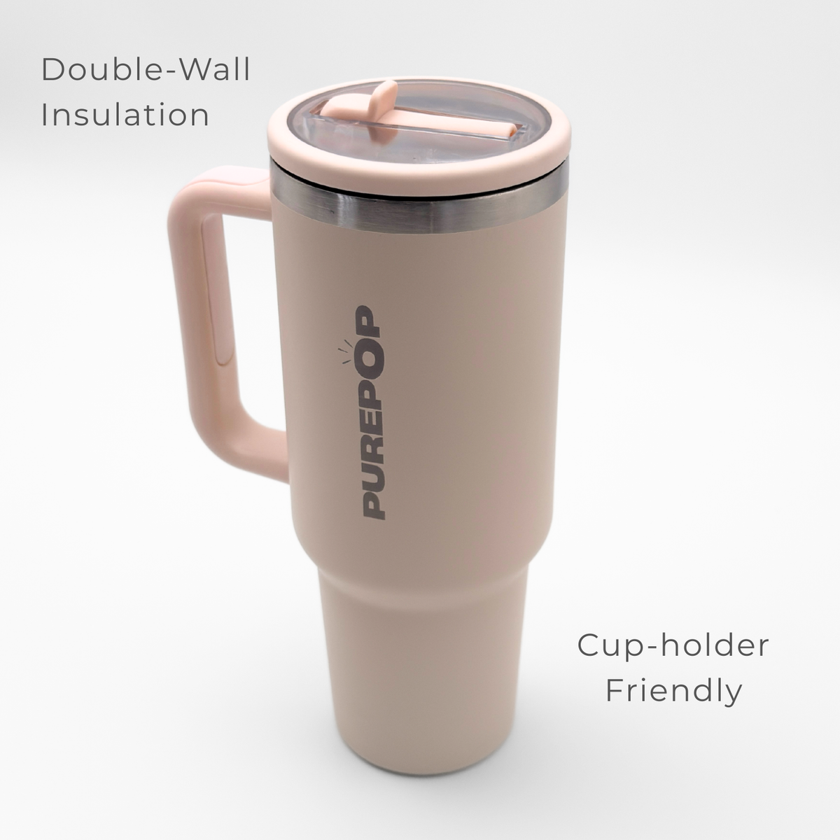 The PurePop™ Carry Series | Rose Quartz is a light pink insulated travel tumbler with a handle and clear lid, featuring double-wall insulation and a cup-holder friendly design—perfect for stylish hydration on the go.
