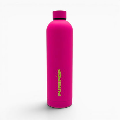 A blush magenta Core Series Plus reusable water bottle with a matching cap stands upright, featuring the word purepop printed vertically in yellow-green letters on the front. The background is plain white.