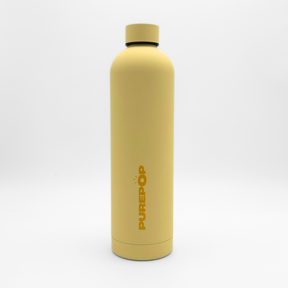 A Canary Yellow Core Series Plus insulated flask with a black cap stands upright on a white background. The word PUREPOP is printed vertically in bold orange letters on the durable stainless steel bottle, which is designed to be completely leakproof.
