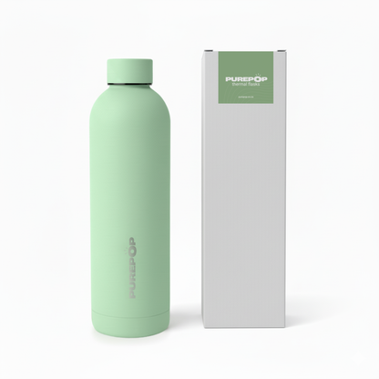 The Core Series | Mint Green insulated water bottle by Purepop features thermal insulation and a leakproof design. It stands next to its white box, both displaying the Purepop brand name and a green label.